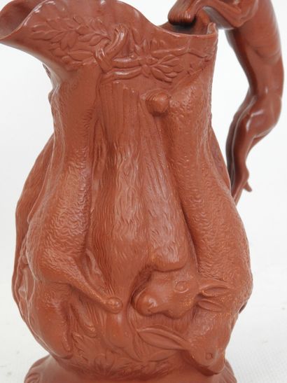PICHET en biscuit marron à décor tournant...
