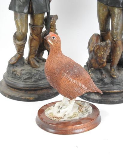 DEUX CHASSEURS en terre cuite à patine polychrome....