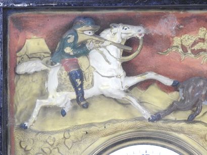 Pendule à décor de chasse et de chasseur,...