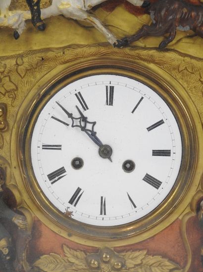 Pendule à décor de chasse et de chasseur,...