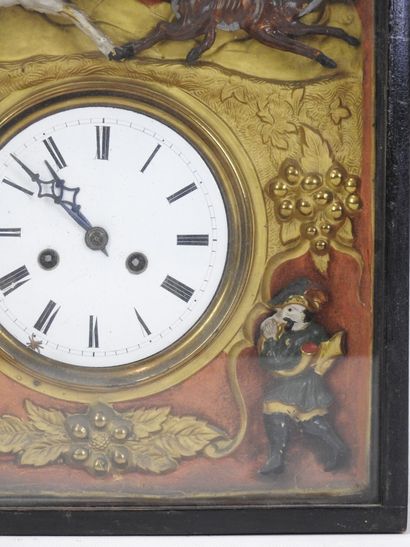 Pendule à décor de chasse et de chasseur,...