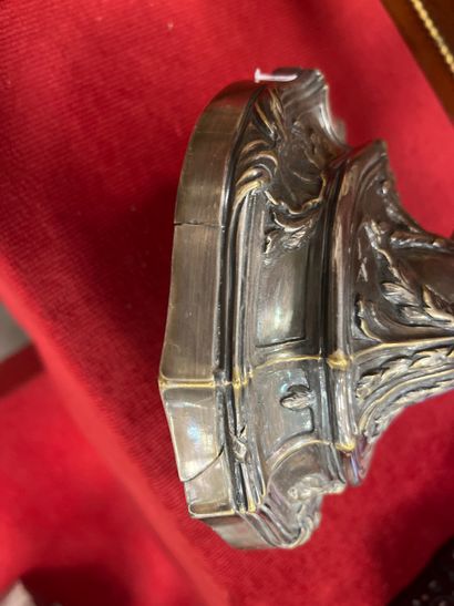 A silver-plated bronze CANDLE-HOLDER decorated...