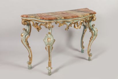 CONSOLE en bois sculpté, stuqué, laqué et...