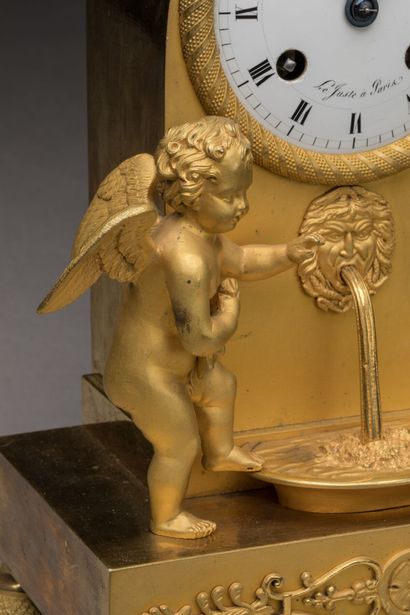 Gilt bronze HANGER with a cherub at a fountain,...