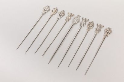 ODIOT: Nine plain silver skewers, decorated...