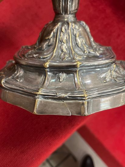 A silver-plated bronze CANDLE-HOLDER decorated...