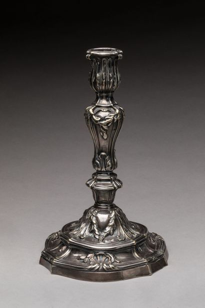 A silver-plated bronze CANDLE-HOLDER decorated...
