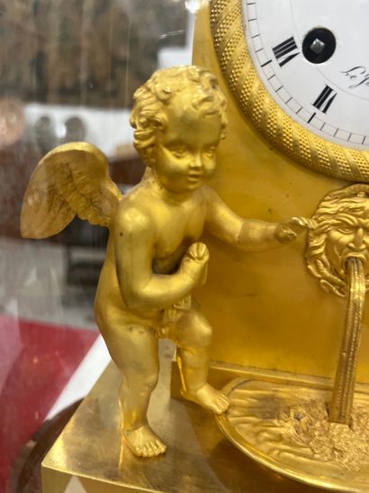 Gilt bronze HANGER with a cherub at a fountain,...