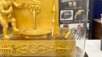 Gilt bronze HANGER with a cherub at a fountain,...