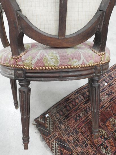 PAIR OF ARMCHAIRS in molded and carved natural...