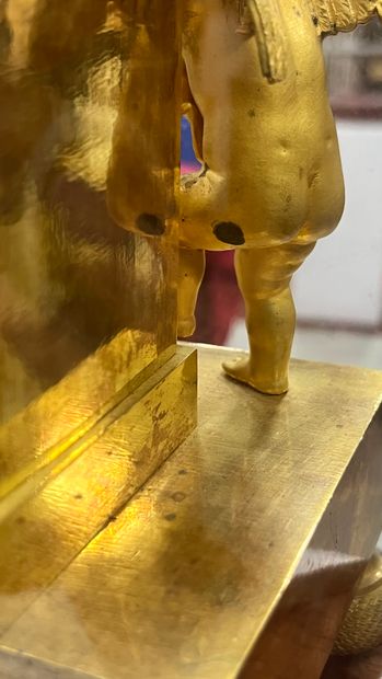 Gilt bronze HANGER with a cherub at a fountain,...