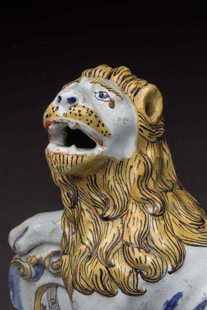 ROUEN: Seated polychrome earthenware lion,...