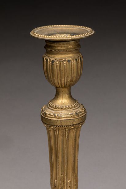 PAIRE DE BOUGEOIRS in chased and gilt bronze....