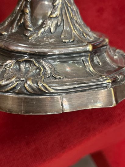 A silver-plated bronze CANDLE-HOLDER decorated...