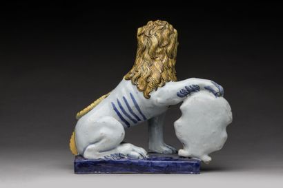 ROUEN: Seated polychrome earthenware lion,...