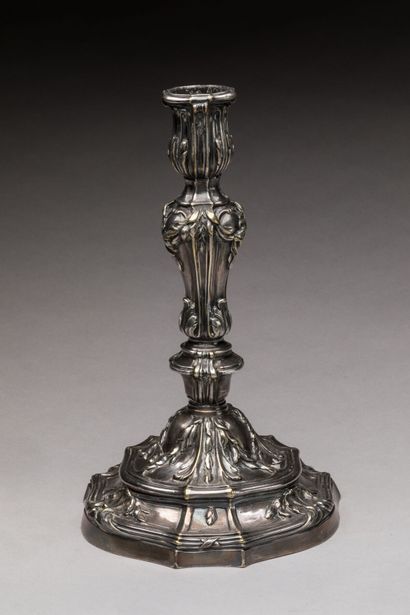 A silver-plated bronze CANDLE-HOLDER decorated...