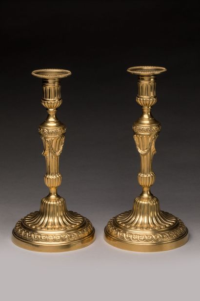CHRISTOFLE: Pair of gilt bronze candlesticks....