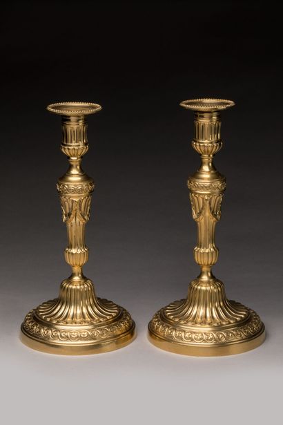 CHRISTOFLE: Pair of gilt bronze candlesticks....