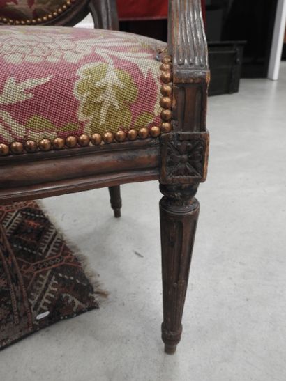PAIR OF ARMCHAIRS in molded and carved natural...