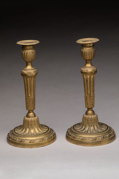 PAIRE DE BOUGEOIRS in chased and gilt bronze....