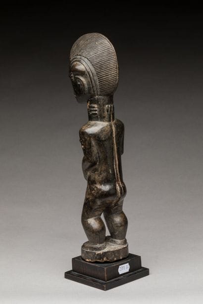 BAOULE, Côte d'Ivoire.
Bois dur, patine d'usage.
Statue...