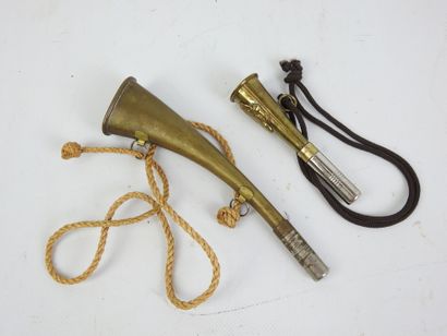 TWO brass PIBOLES, one decorated with a hure....