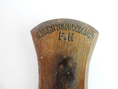 HONORARY FEET of fox mounted on oak escutcheon,...
