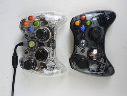 XBOX : 2 consoles XboX 360 noires 2011 et...