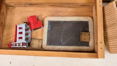 Wooden trunk containing three trays of plastic...