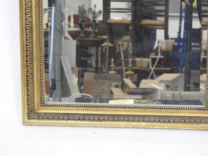 Gilded stuccoed wood TRUMEAU decorated with...