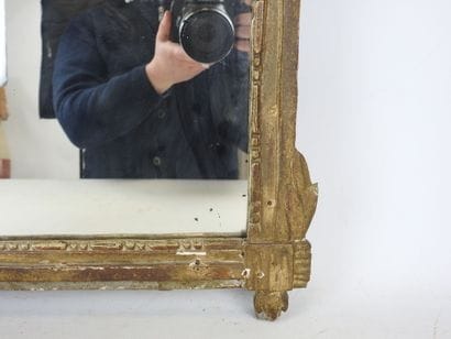 Gilded stuccoed wood MIRROR, the pediment...