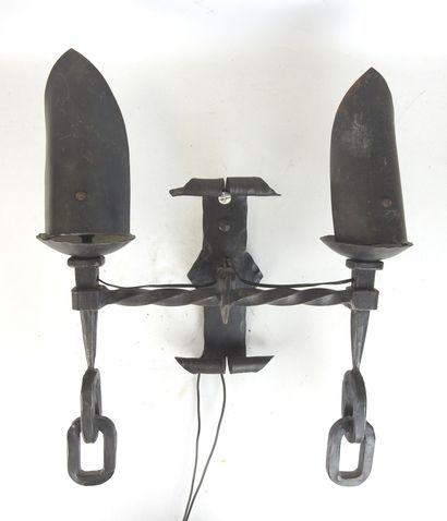 Wrought-iron sconce with two arms forming...