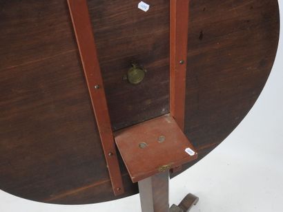 Circular walnut GUERIDON, tilting top inlaid...