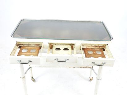 DENTIST'S TABLE on castors in white lacquered...
