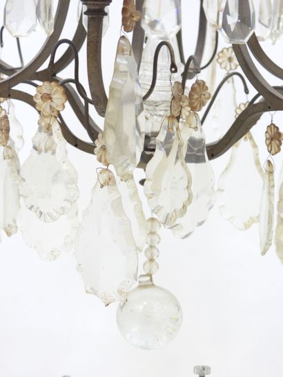 Iron chandelier with six arms adorned with...