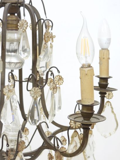 Iron chandelier with six arms adorned with...