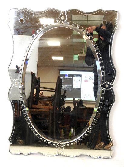 Venetian glass mirror with curved edge and...
