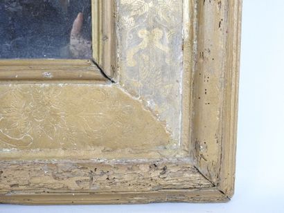 Gilded stuccoed wood mirror with incised...
