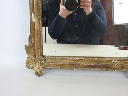 Gilded stuccoed wood MIRROR, the pediment...