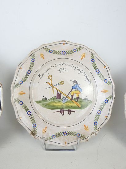 NEVERS: Three earthenware scalloped rim plates...