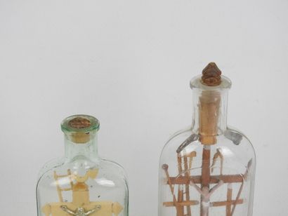 TWO EX-VOTOS in glass bottles. H (tallest):...