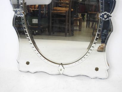 Venetian glass mirror with curved edge and...