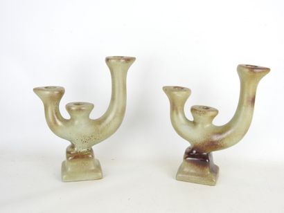 Pair of grey-brown glazed earthenware CANDLES...