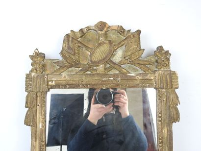 Gilded stuccoed wood MIRROR, the pediment...