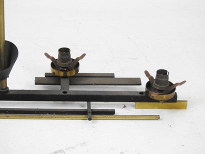 TWO black lacquered and gilded metal SUSPENSIONS...