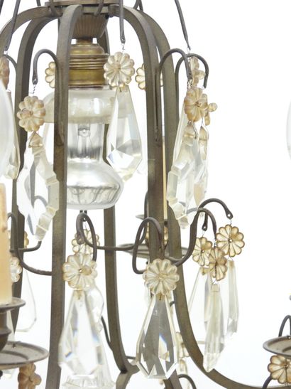 Iron chandelier with six arms adorned with...