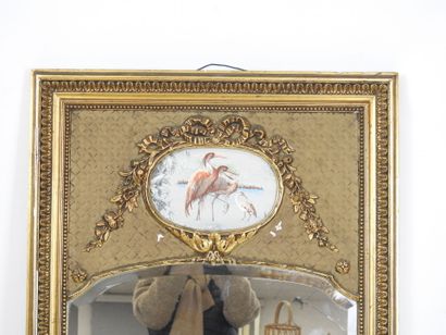 Gilded stuccoed wood TRUMEAU decorated with...