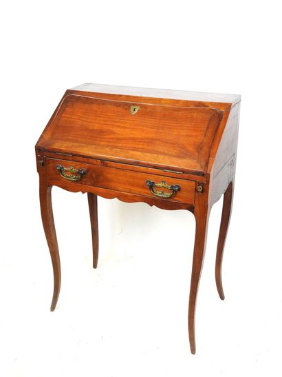 Walnut veneered sloping desk, opening with...