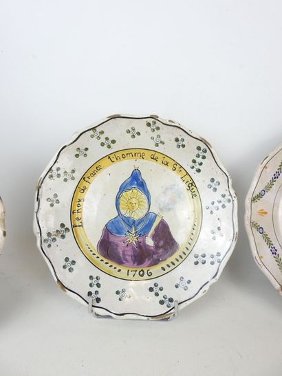 NEVERS: Three earthenware scalloped rim plates...