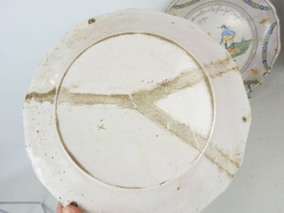 NEVERS: Three earthenware scalloped rim plates...
